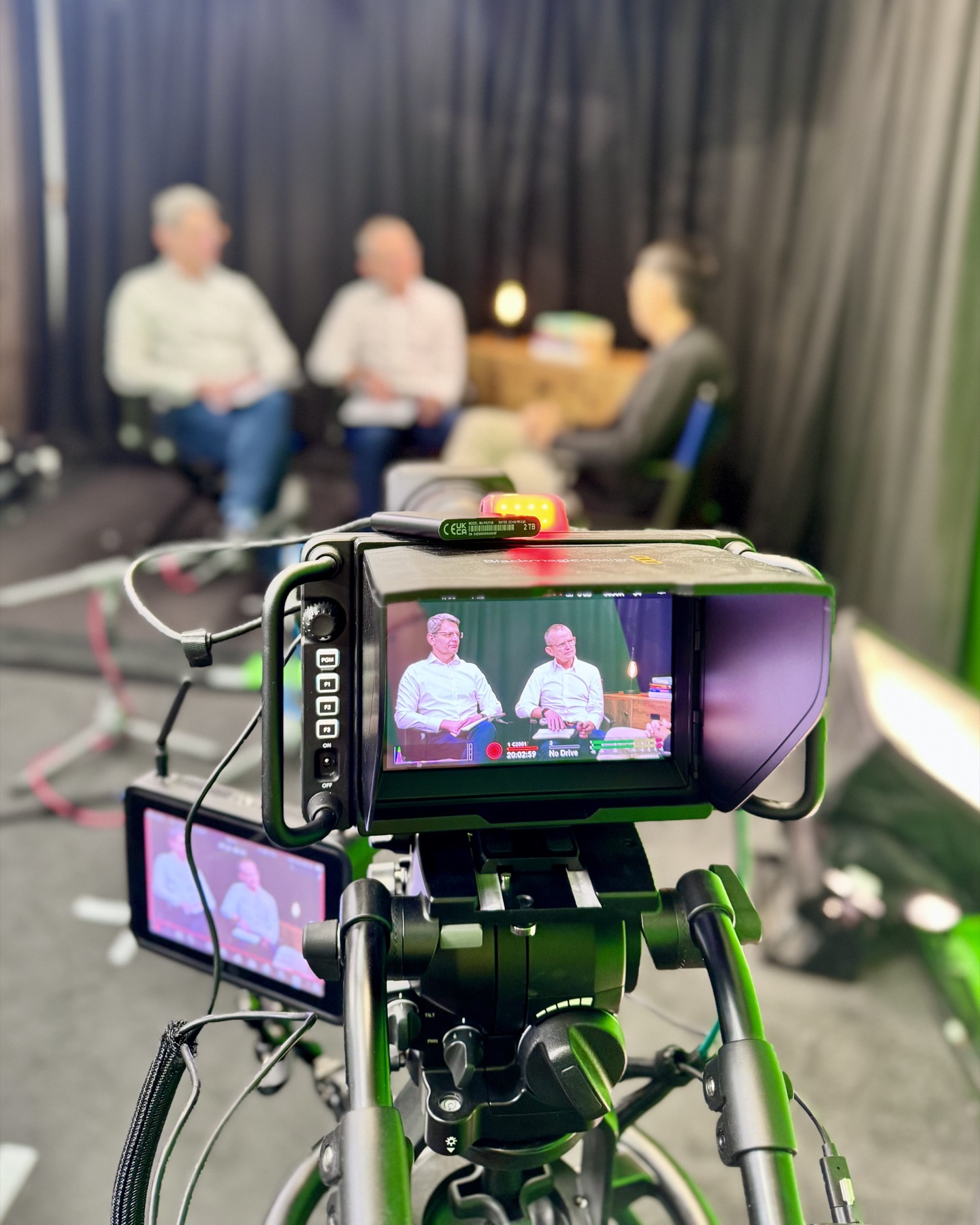 A production camera and monitor recording an interview-led London Business School film