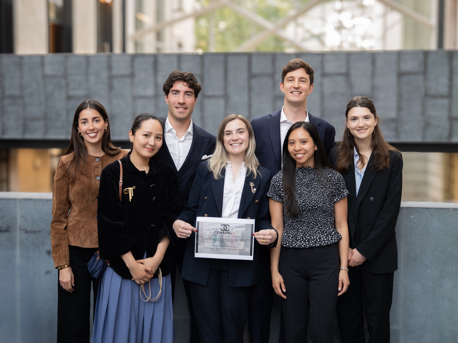 A group of seven people at a Chanel and London Business School project, photographed by Mihaela Motica